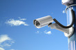 Security camera on blue sky background
