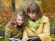 Photo: Mother and daughter with a book Mother and daughter with a book