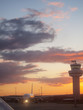 Airplane and air traffic control tower at airport
