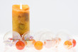 Burning Candle and Christmas Ornaments
