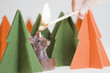 Lighting Reindeer candle with a match