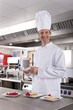 Chef preparing gourmet desserts in commercial kitchen