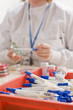 Technician swabbing petri dish in laboratory