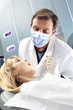 Dentist looking into girl's mouth