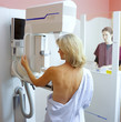 Woman receiving mammogram in clinic