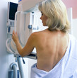 Woman receiving mammogram in clinic