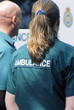 Paramedics standing outside ambulance