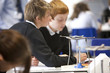 Boys experimenting with Bunsen burner in science class