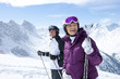 Foto: Smiling senior couple with skis on snowy mountain Smiling senior couple with skis on snowy mountain