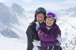 Foto: Portrait of smiling senior couple on snowy mountain Portrait of smiling senior couple on snowy mountain
