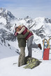 Smiling senior couple hugging on snowy mountain