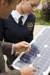 Photo: Teacher and female student with solar panel Teacher and female student with solar panel