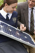 Photo: Teacher and female student with solar panel Teacher and female student with solar panel