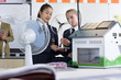 Photo: Female students in school uniforms holding wind turbine model in science class Female students in school uniforms holding wind turbine model in science class