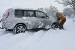 Photo: Woman shoveling snow near car Woman shoveling snow near car