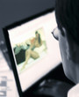 Businessman looking at pornography on office computer