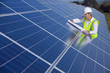 Engineer inspecting solar panels