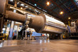 Engineers working on metal machinery