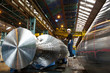 Engineers working on metal machinery