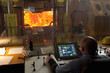 Man working in steelworks control room