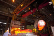 Molten forged steel being removed from furnace with crane