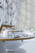 Digital tablet, eyeglasses and water on table