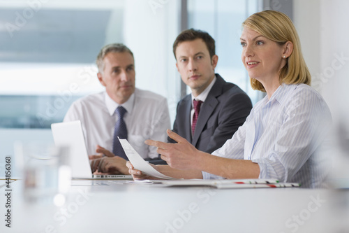 Photo: Confident businesswoman talking in meeting Confident businesswoman talking in meeting