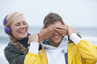 Young woman covering boyfriendճ eyes on beach