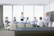 Businesswoman leading meeting in conference room