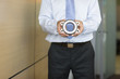 Businessman holding bearing part