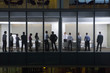 View of business people standing in conference room form outdoors