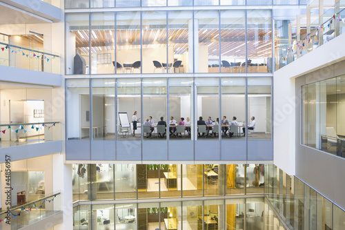 Photo: View of business people meeting in conference room of modern building View of business people meeting in conference room of modern building