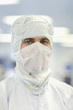 Photo: Close up portrait of scientist in clean suit Close up portrait of scientist in clean suit