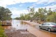 Normal car waiting at flooded road
