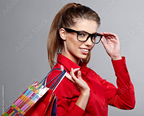 Photo: Shopping. Excited woman shopper with a big grin and a lot of sho Shopping. Excited woman shopper with a big grin and a lot of sho