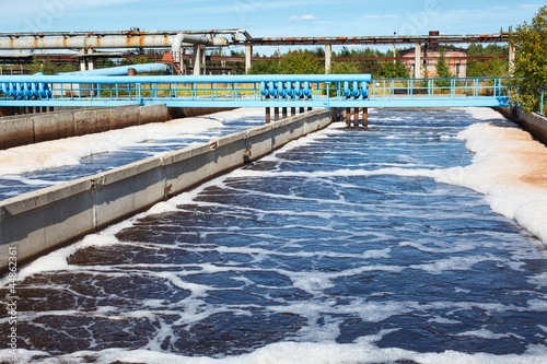 Photo: Oxygen aeration of sewage water. Blue air pipelines Oxygen aeration of sewage water. Blue air pipelines