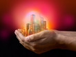 Illustration: Golden business city center on hands Golden business city center on hands