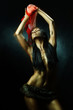 Photo: Bronze tanned wild latin woman dancing with red scarf Bronze tanned wild latin woman dancing with red scarf