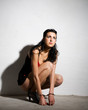 sexy woman dressed in lingerie and handcuffed in a cellar