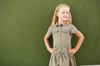 Photo: Scoolgirl standing near blackboard Scoolgirl standing near blackboard