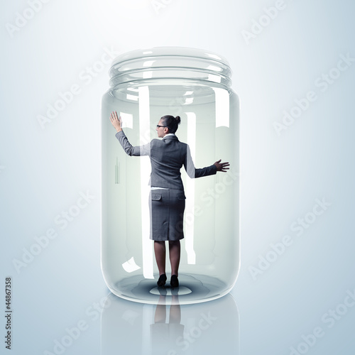 Photo: Businesswoman inside glass jar Businesswoman inside glass jar