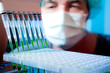 Senior scientist loads pcr plate to amplify DNA