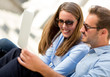 Couple on holidays with a laptop
