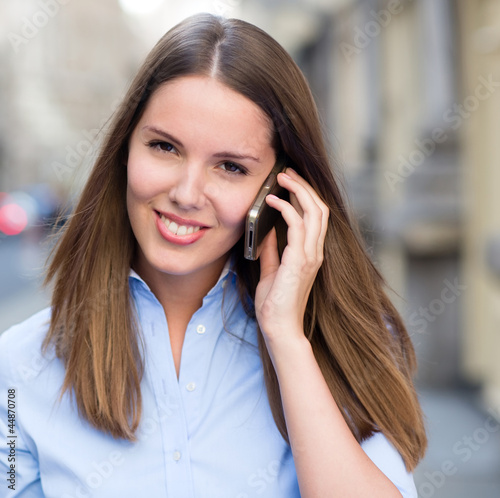 Photo: Woman talking on the phone Woman talking on the phone