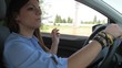 Young businessman smoking cigarette in car