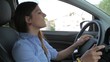 Pretty businesswoman singing in car