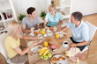 Photo: Happy family enjoying breakfast Happy family enjoying breakfast