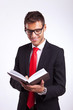Young Man In A Suit Reading An...