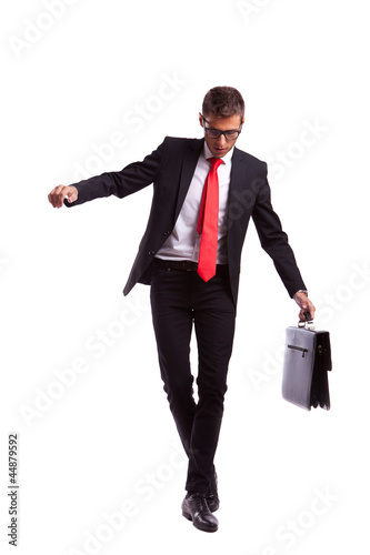Photo: Business man balancing and walking forward Business man balancing and walking forward