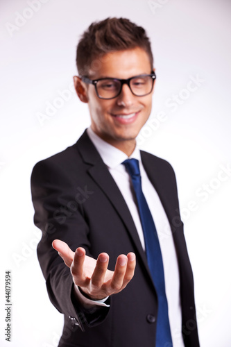 Photo: business man holding something on his hand business man holding something on his hand